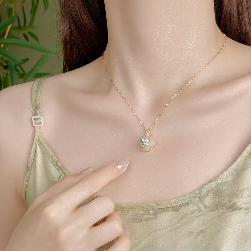 Buddha Stones en jade Hetian avec papillon et magnolia