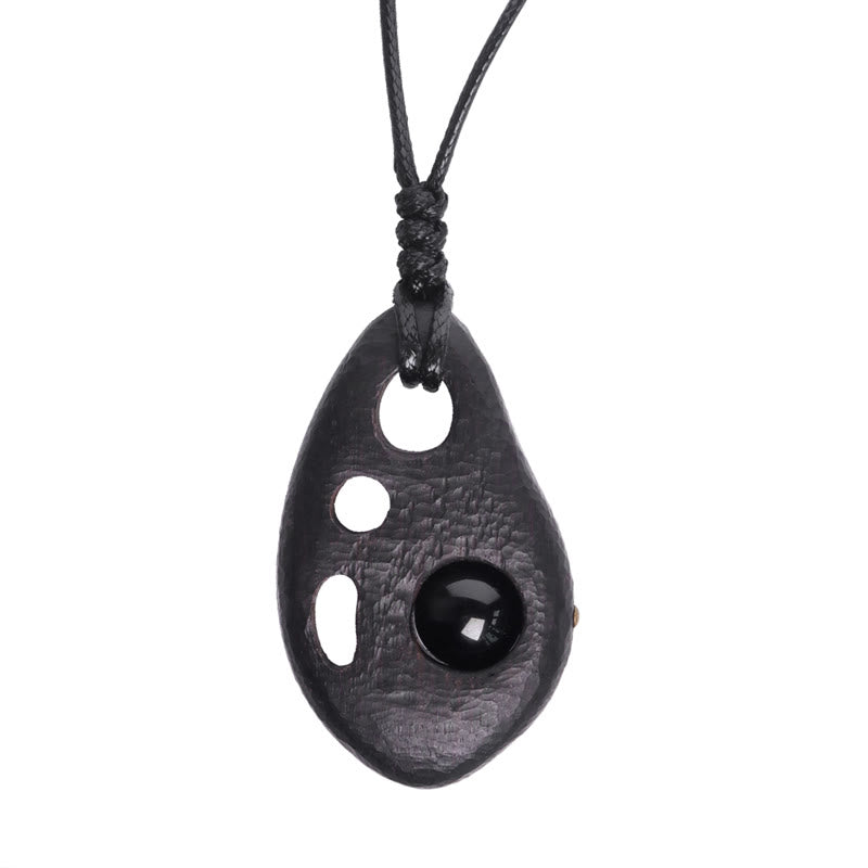 Collier pendentif en obsidienne creuse avec Buddha Stones en bois d'ébène et incrustations de paix et de calme