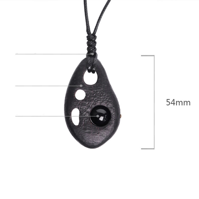 Collier pendentif en obsidienne creuse avec Buddha Stones en bois d'ébène et incrustations de paix et de calme