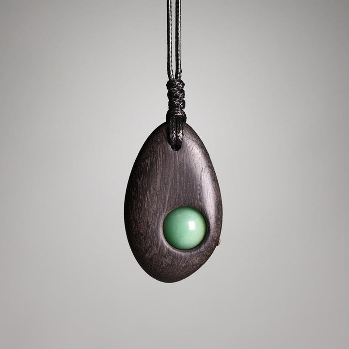 Buddha Stones Collier pendentif paix calme en bois d'ébène et aventurine verte