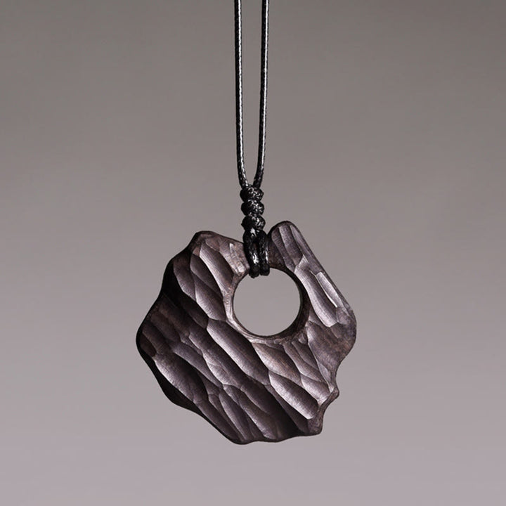 Collier pendentif en bois d'ébène avec Buddha Stones, forme creuse irrégulière, équilibre de la paix