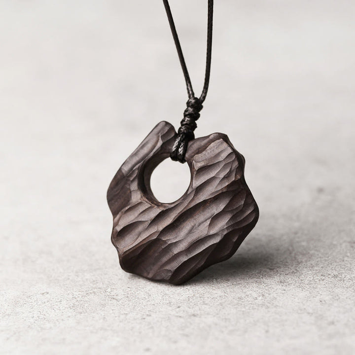 Collier pendentif en bois d'ébène avec Buddha Stones, forme creuse irrégulière, équilibre de la paix