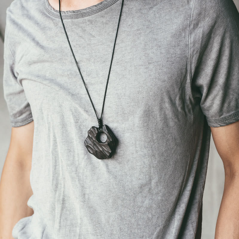 Collier pendentif en bois d'ébène avec Buddha Stones, forme creuse irrégulière, équilibre de la paix