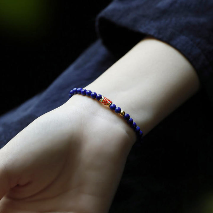 Bracelet positif en Buddha Stones et lazurite avec poisson koï