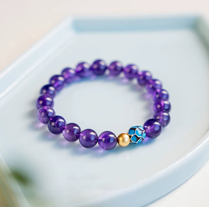 Bracelet de conscience spirituelle en améthyste naturelle et lotus de Buddha Stones