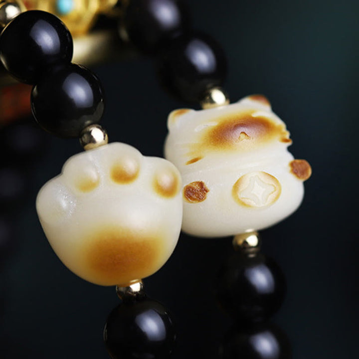 Bracelet de purification porte-bonheur en obsidienne Buddha Stones avec patte de chat et graine de Bodhi - image 11