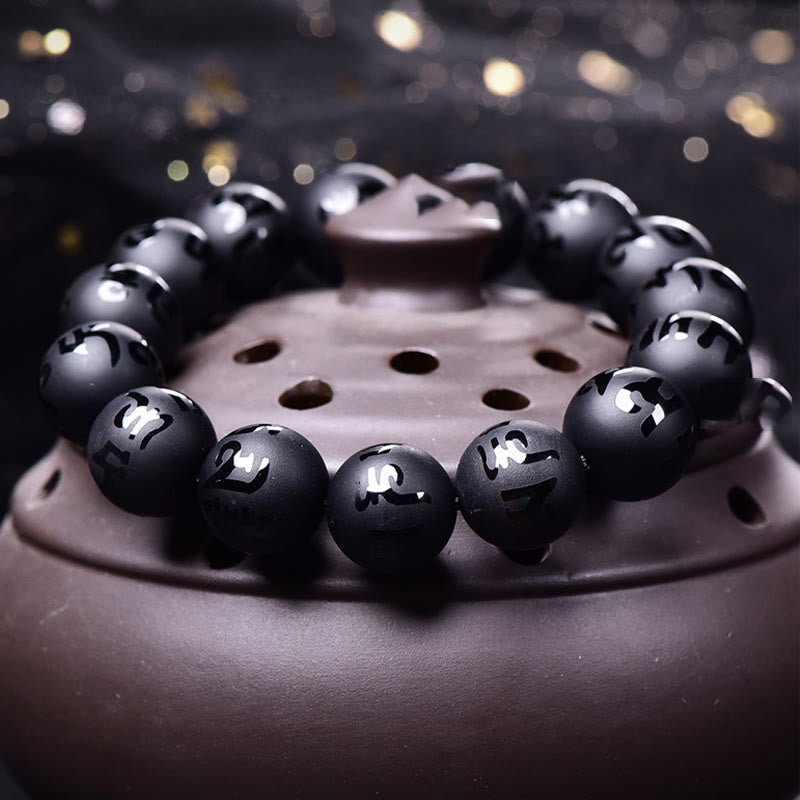 Bracelet de protection sculpté en onyx noir naturel Buddha Stones Om Mani Padme Hum