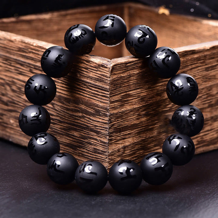 Bracelet de protection sculpté en onyx noir naturel Buddha Stones Om Mani Padme Hum