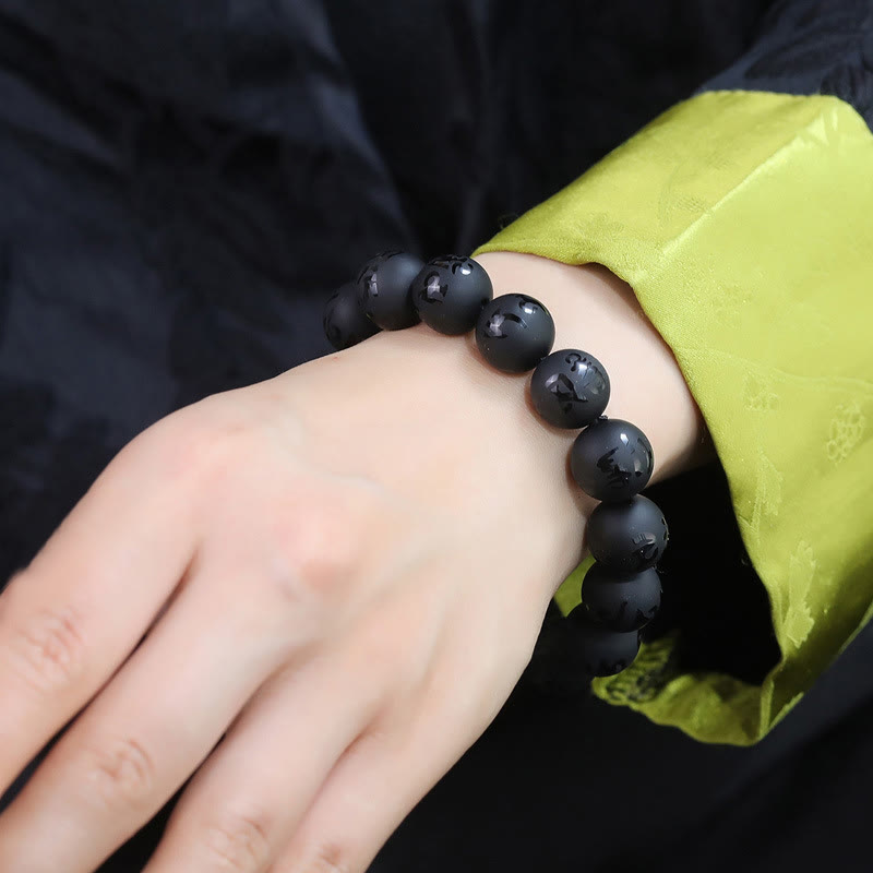 Bracelet de protection sculpté en onyx noir naturel Buddha Stones Om Mani Padme Hum