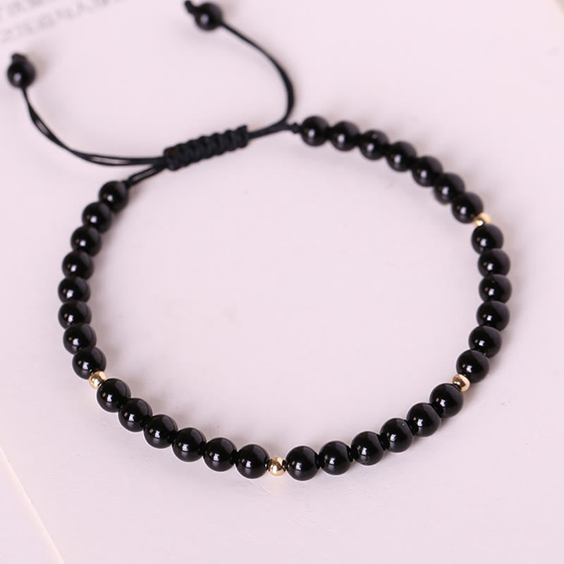 Bracelet en corde avec petites perles d'obsidienne noire Buddha Stones