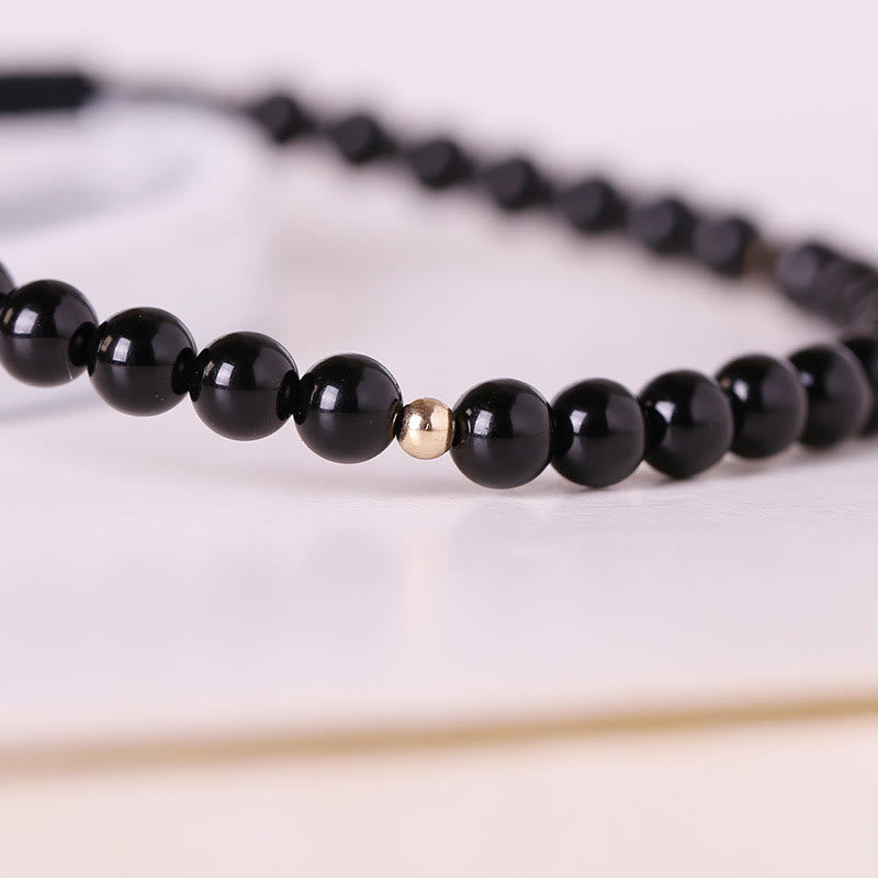 Bracelet en corde avec petites perles d'obsidienne noire Buddha Stones