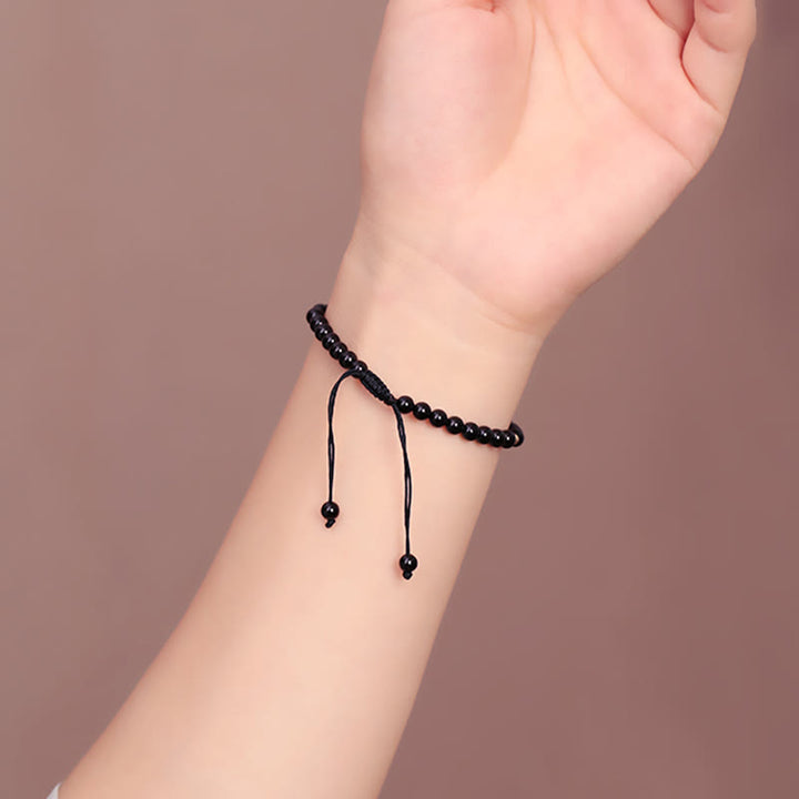 Bracelet en corde avec petites perles d'obsidienne noire Buddha Stones