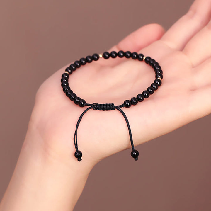 Bracelet en corde avec petites perles d'obsidienne noire Buddha Stones