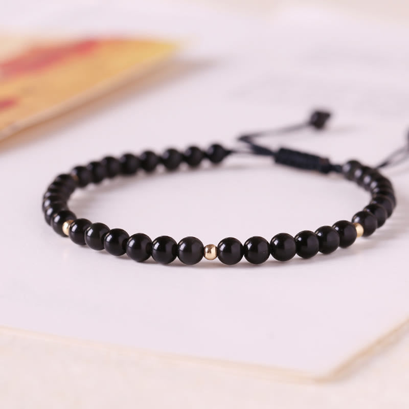 Bracelet en corde avec petites perles d'obsidienne noire Buddha Stones