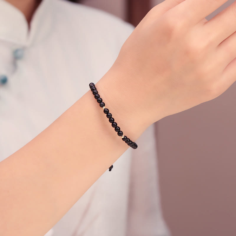 Bracelet en corde avec petites perles d'obsidienne noire Buddha Stones