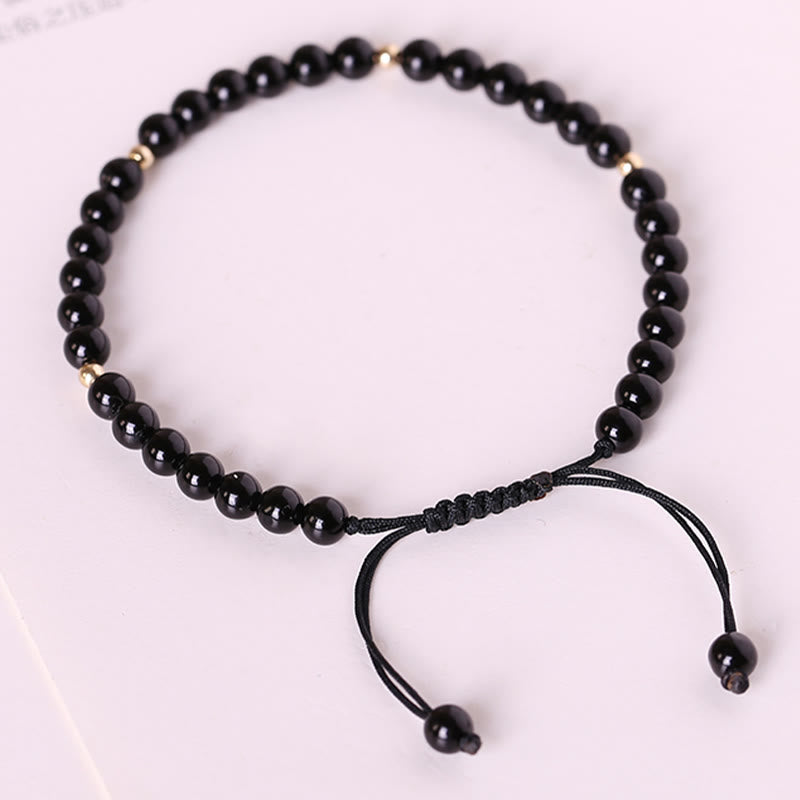 Bracelet en corde avec petites perles d'obsidienne noire Buddha Stones