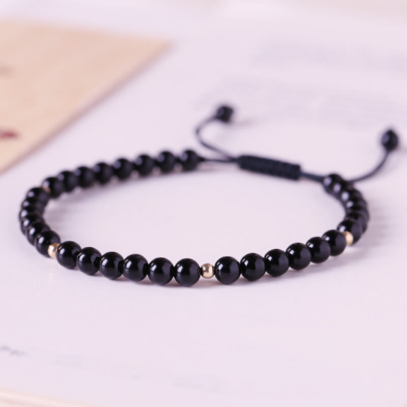 Bracelet en corde avec petites perles d'obsidienne noire Buddha Stones