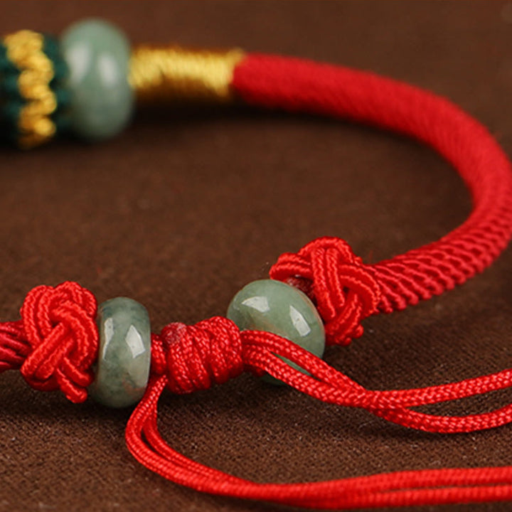 Bracelet en corde rouge avec perles de boulier en jade et Buddha Stones
