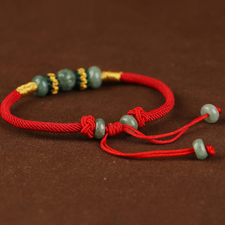 Bracelet en corde rouge avec perles de boulier en jade et Buddha Stones
