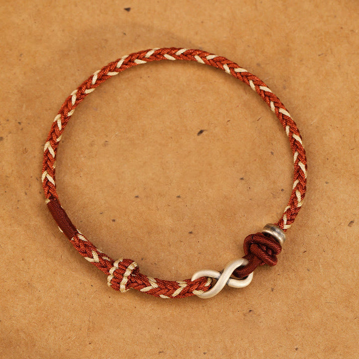 Bracelet en corde porte-bonheur en argent sterling 999 fait à la main avec des Buddha Stones et un symbole de l'infini sans fin