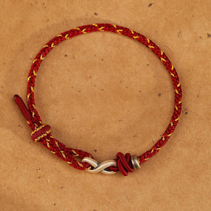 Bracelet en corde porte-bonheur en argent sterling 999 fait à la main avec des Buddha Stones et un symbole de l'infini sans fin