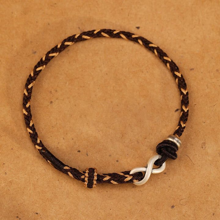 Bracelet en corde porte-bonheur en argent sterling 999 fait à la main avec des Buddha Stones et un symbole de l'infini sans fin