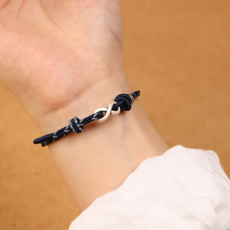 Bracelet en corde porte-bonheur en argent sterling 999 fait à la main avec des Buddha Stones et un symbole de l'infini sans fin