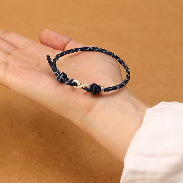 Bracelet en corde porte-bonheur en argent sterling 999 fait à la main avec des Buddha Stones et un symbole de l'infini sans fin