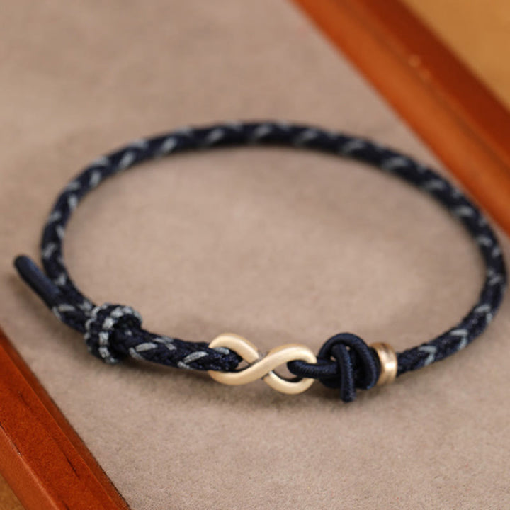 Bracelet en corde porte-bonheur en argent sterling 999 fait à la main avec des Buddha Stones et un symbole de l'infini sans fin