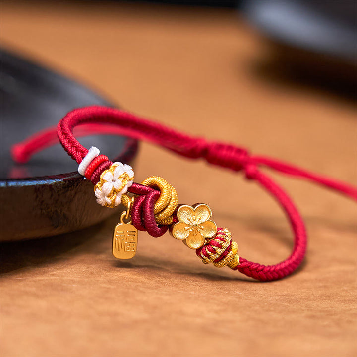Bracelet porte-bonheur en fil rouge avec Buddha Stones et fleur de pêcher