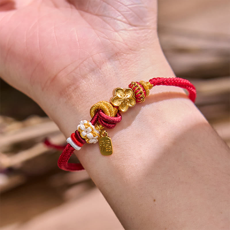 Bracelet porte-bonheur en fil rouge avec Buddha Stones et fleur de pêcher