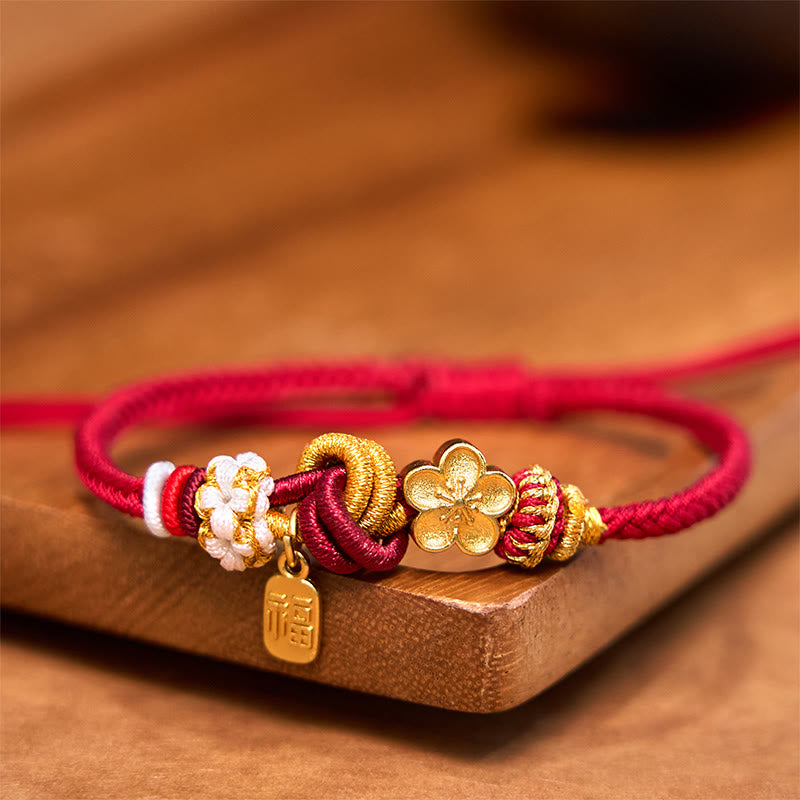 Bracelet porte-bonheur en fil rouge avec Buddha Stones et fleur de pêcher