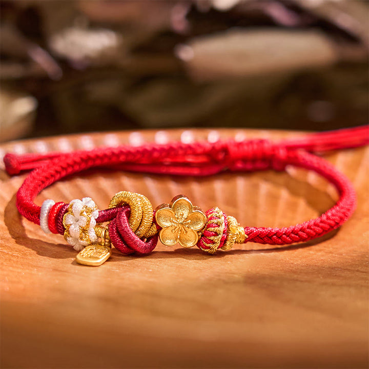 Bracelet porte-bonheur en fil rouge avec Buddha Stones et fleur de pêcher