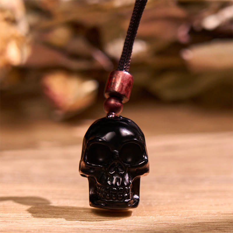Collier pendentif en obsidienne noire avec Buddha Stones et squelette Shmashana