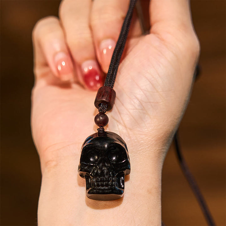 Collier pendentif en obsidienne noire avec Buddha Stones et squelette Shmashana