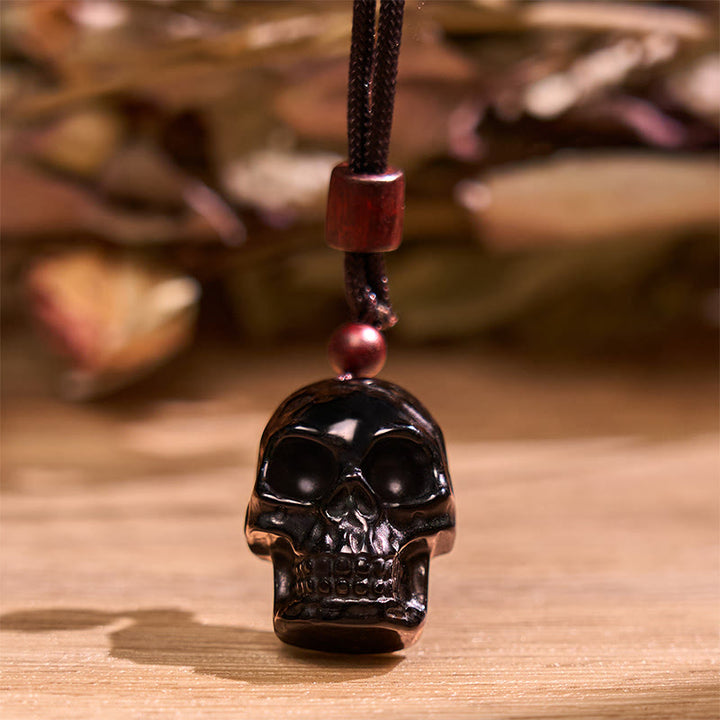 Collier pendentif en obsidienne noire avec Buddha Stones et squelette Shmashana
