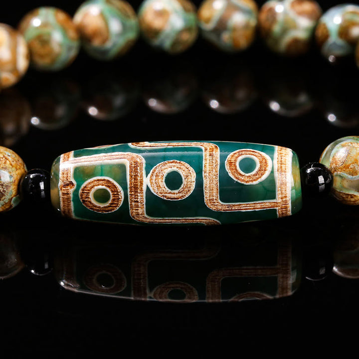 Bracelet de protection et de pouvoir en agate œil de chat blanche et bois de santal naturel avec Buddha Stones tibétaines à neuf yeux Dzi