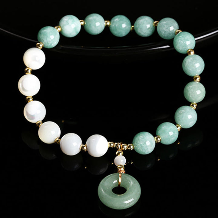 Bracelet d'abondance avec breloque en forme de boucle de paix , Buddha Stones , jade, trochus, fer à cheval, escargot