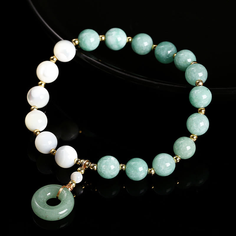 Bracelet d'abondance avec breloque en forme de boucle de paix , Buddha Stones , jade, trochus, fer à cheval, escargot