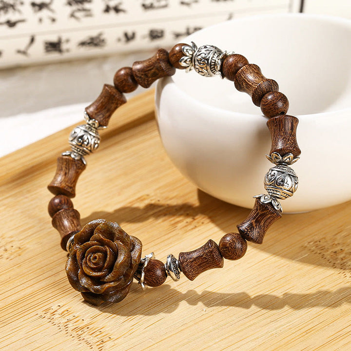 Bracelet de guérison camélia en bois de santal et bambou avec Buddha Stones