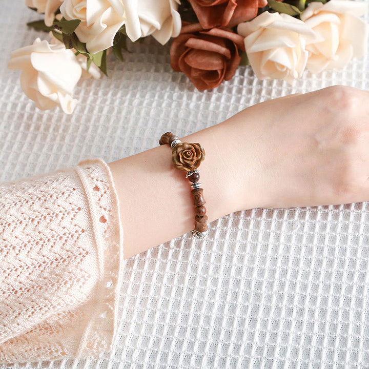 Bracelet de guérison camélia en bois de santal et bambou avec Buddha Stones