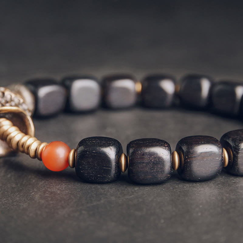 Bracelet de paix en Buddha Stones, bois d'ébène, cuivre, laiton, agate rouge