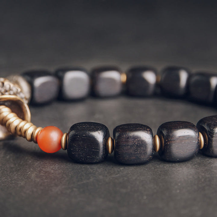 Bracelet de paix en Buddha Stones, bois d'ébène, cuivre, laiton, agate rouge