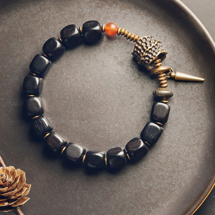 Bracelet de paix en Buddha Stones, bois d'ébène, cuivre, laiton, agate rouge
