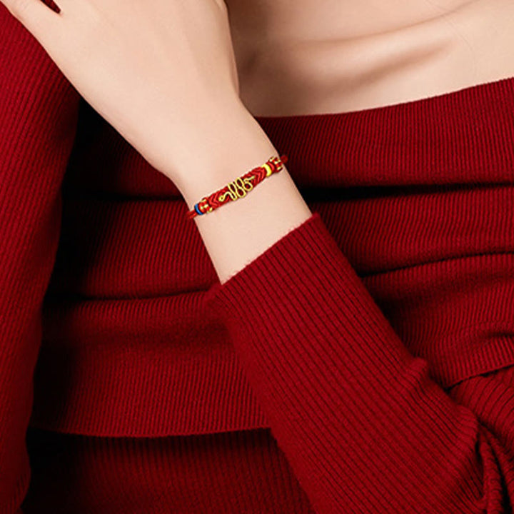 Bracelet tressé de protection à huit fils avec Buddha Stones et nœud de paix rouge Année du serpent