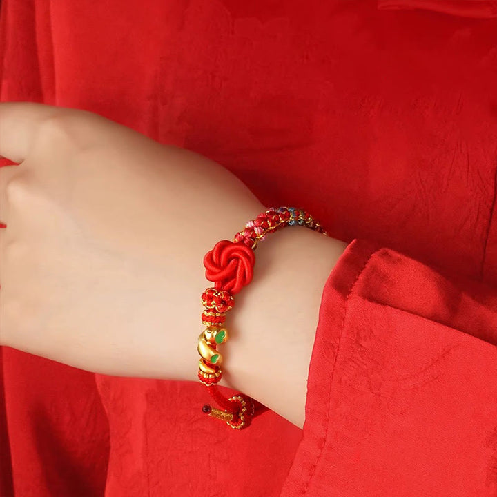 Bracelet tressé de protection de l'année du serpent avec Buddha Stones mandala en fil rouge tissé à la main avec fleurs colorées