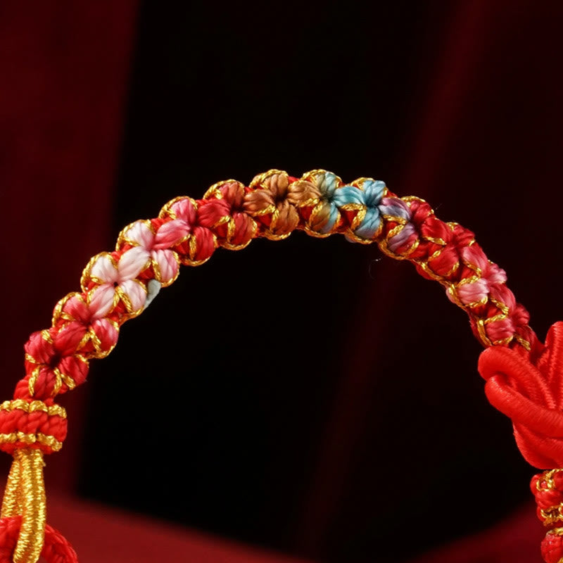 Bracelet tressé de protection de l'année du serpent avec Buddha Stones mandala en fil rouge tissé à la main avec fleurs colorées