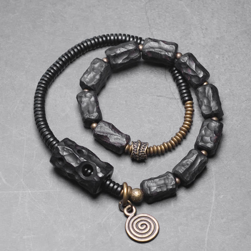 Bracelet double tour en Buddha Stones, bois d'ébène, cuivre, laiton, agate rouge, paix