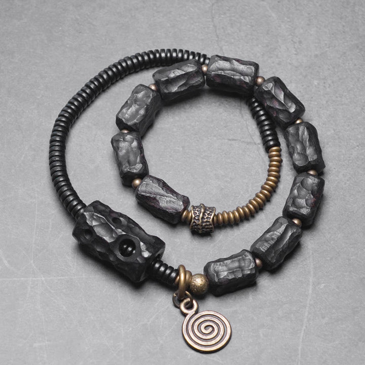 Bracelet double tour en Buddha Stones, bois d'ébène, cuivre, laiton, agate rouge, paix