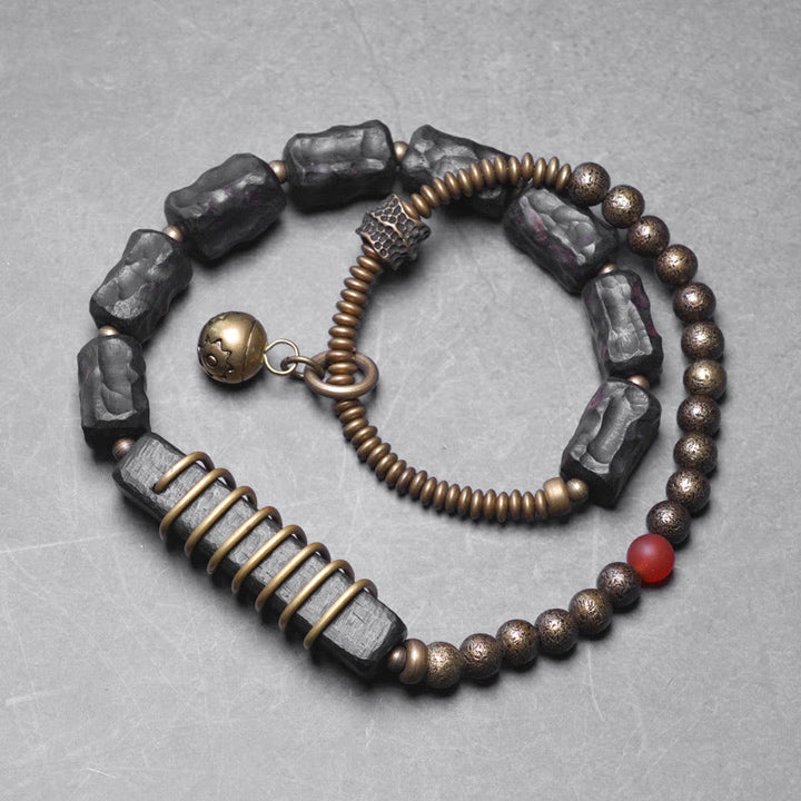 Bracelet double tour en Buddha Stones, bois d'ébène, cuivre, laiton, agate rouge, paix